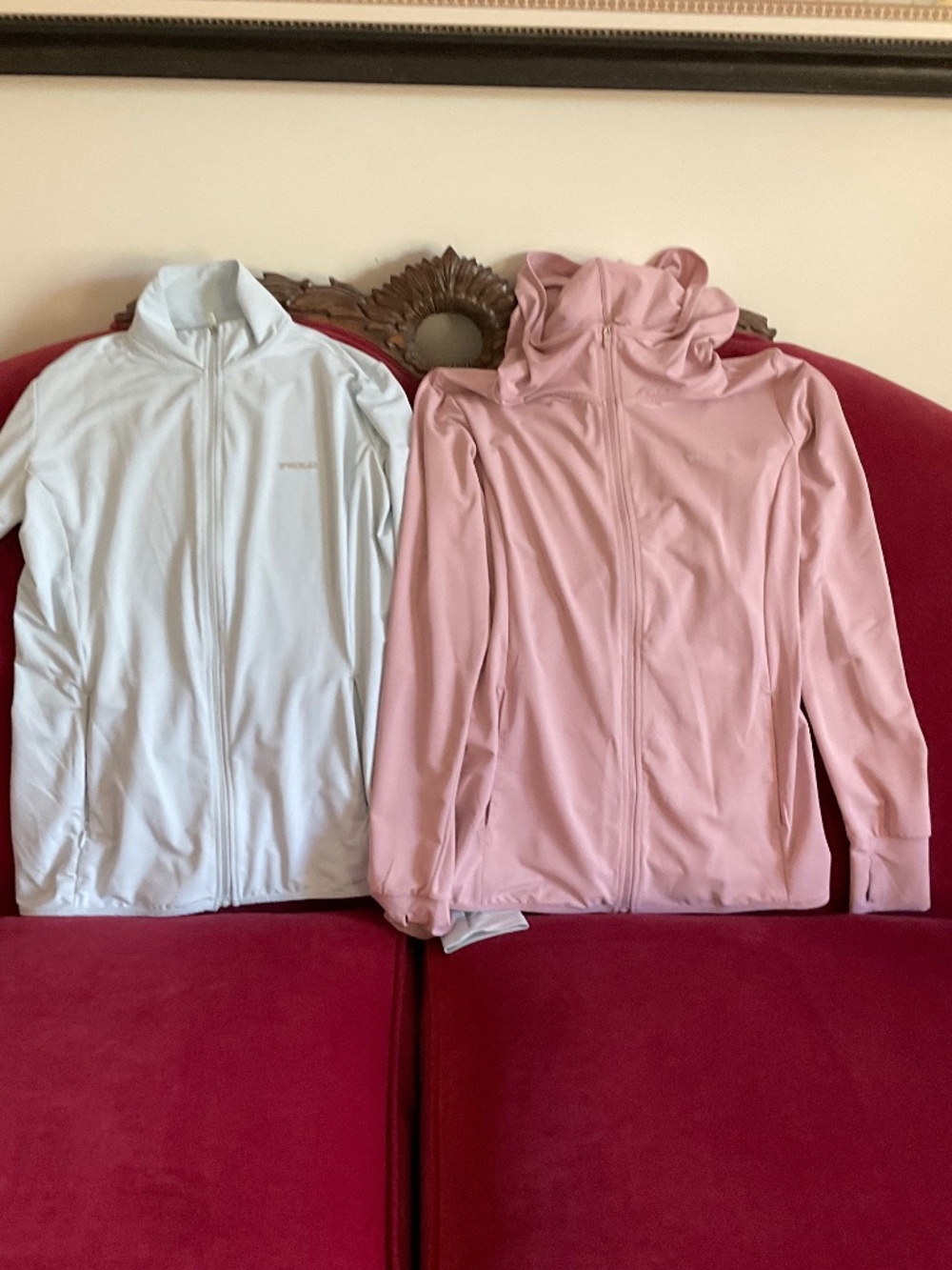 Pair of full zip SPF jackets